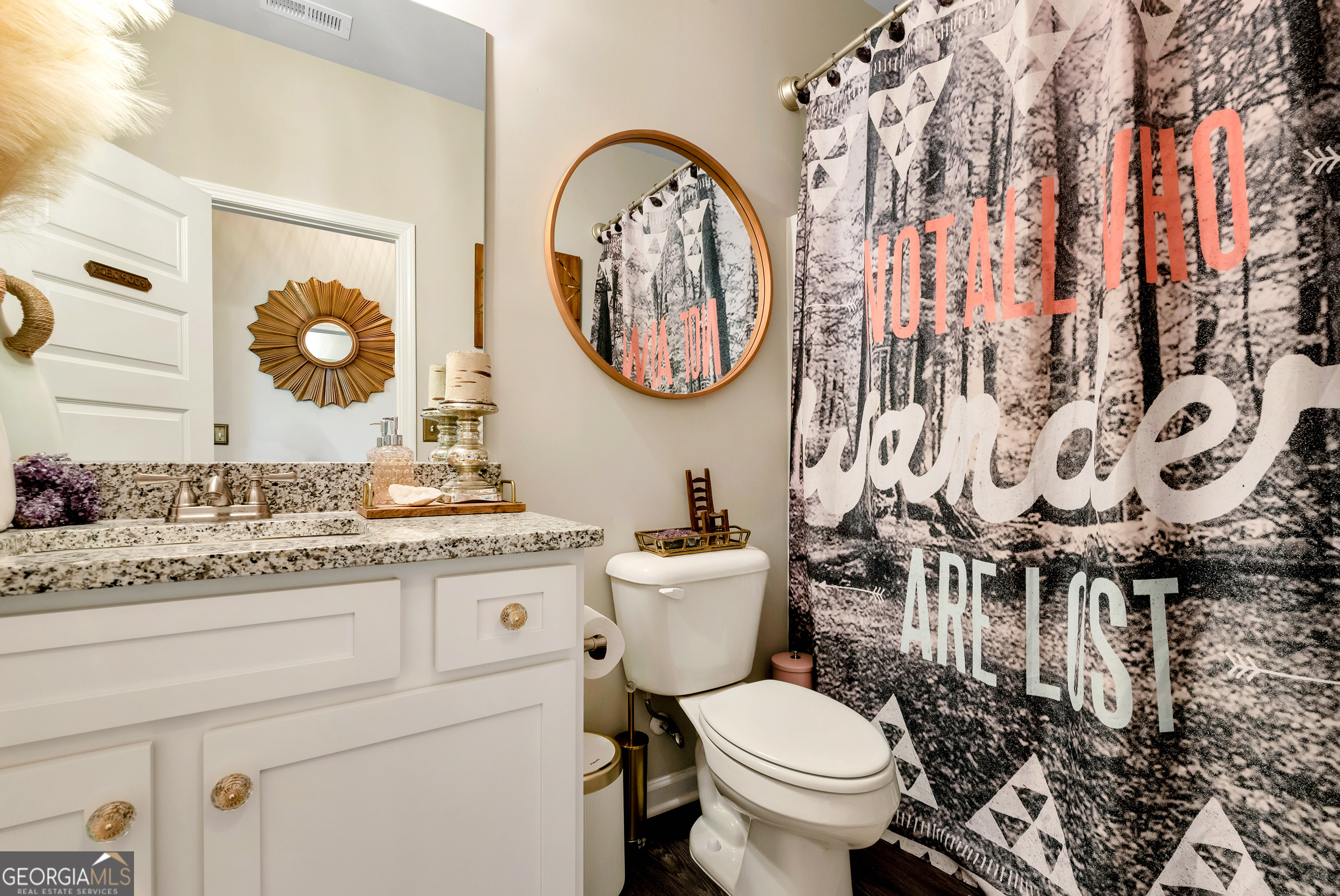 425 Crystal Way Cornelia, GA 30531 - Photo 21 of 46 a bathroom with a toilet a sink and a mirror