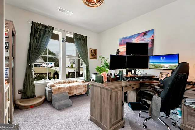 a bedroom with a workspace