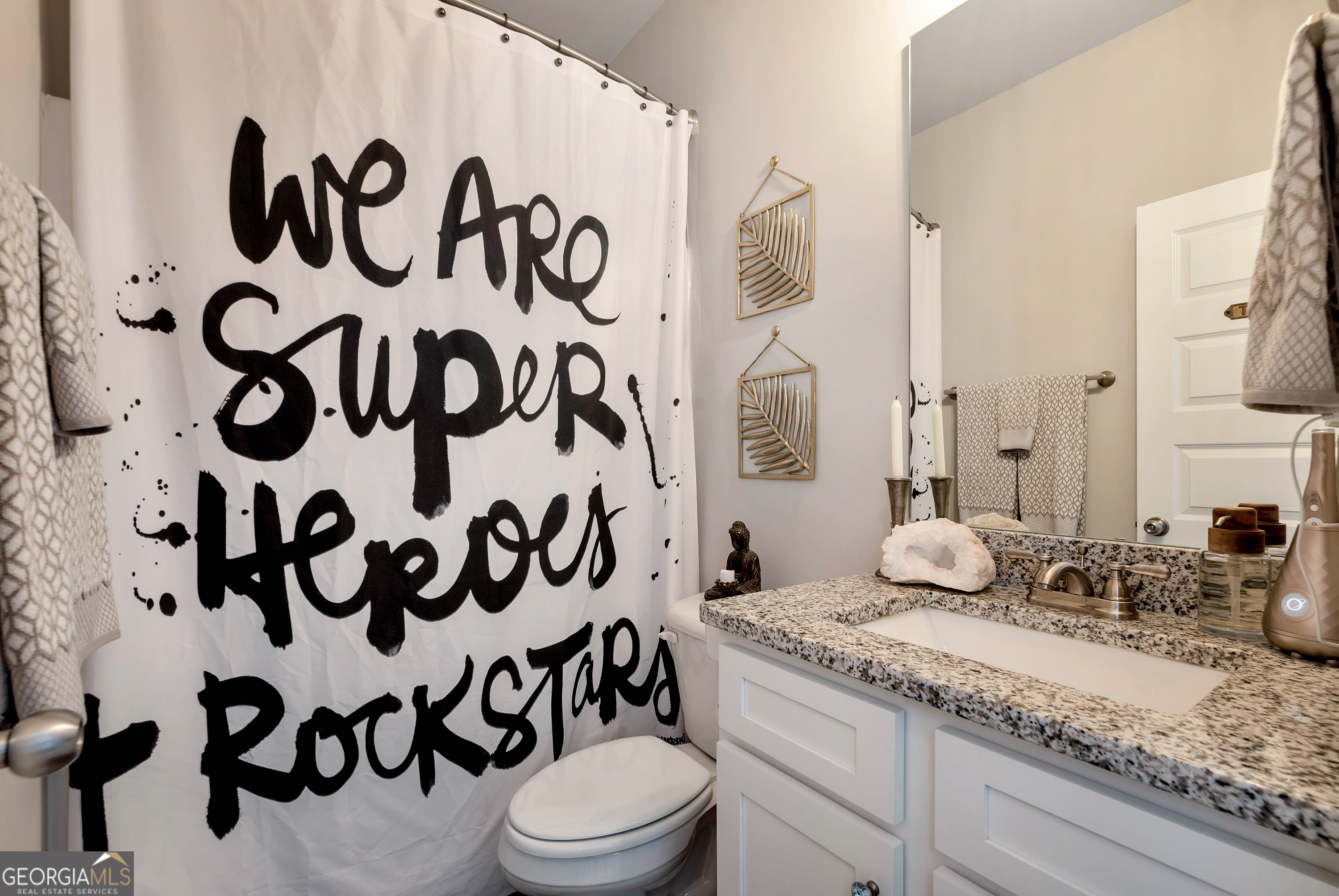 425 Crystal Way Cornelia, GA 30531 - Photo 23 of 46 a bathroom with a granite countertop sink and a mirror