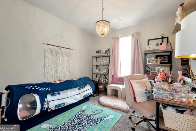 a living room with furniture a rug and a window