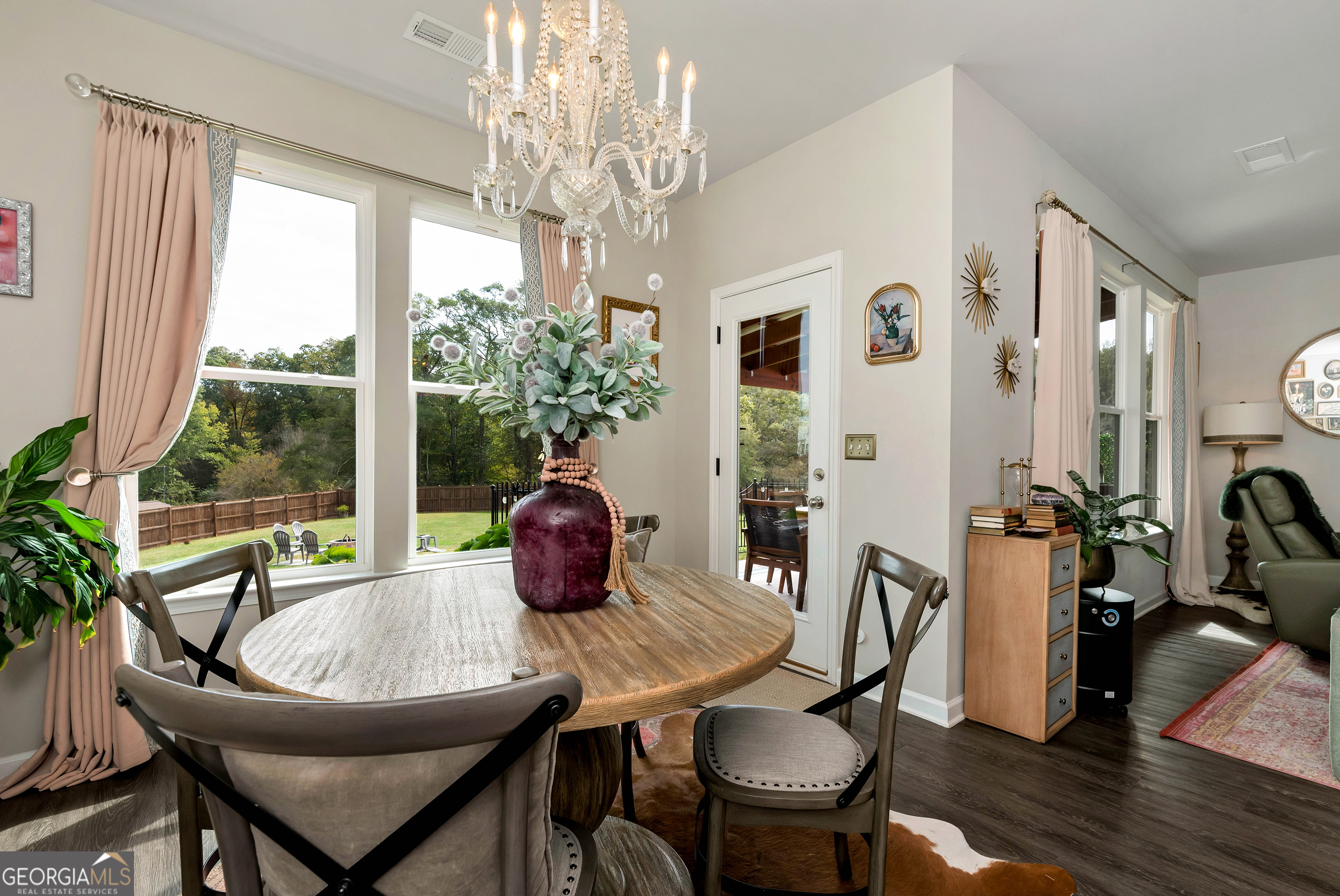 425 Crystal Way Cornelia, GA 30531 - Photo 25 of 46 a dining room with furniture a chandelier and wooden floor
