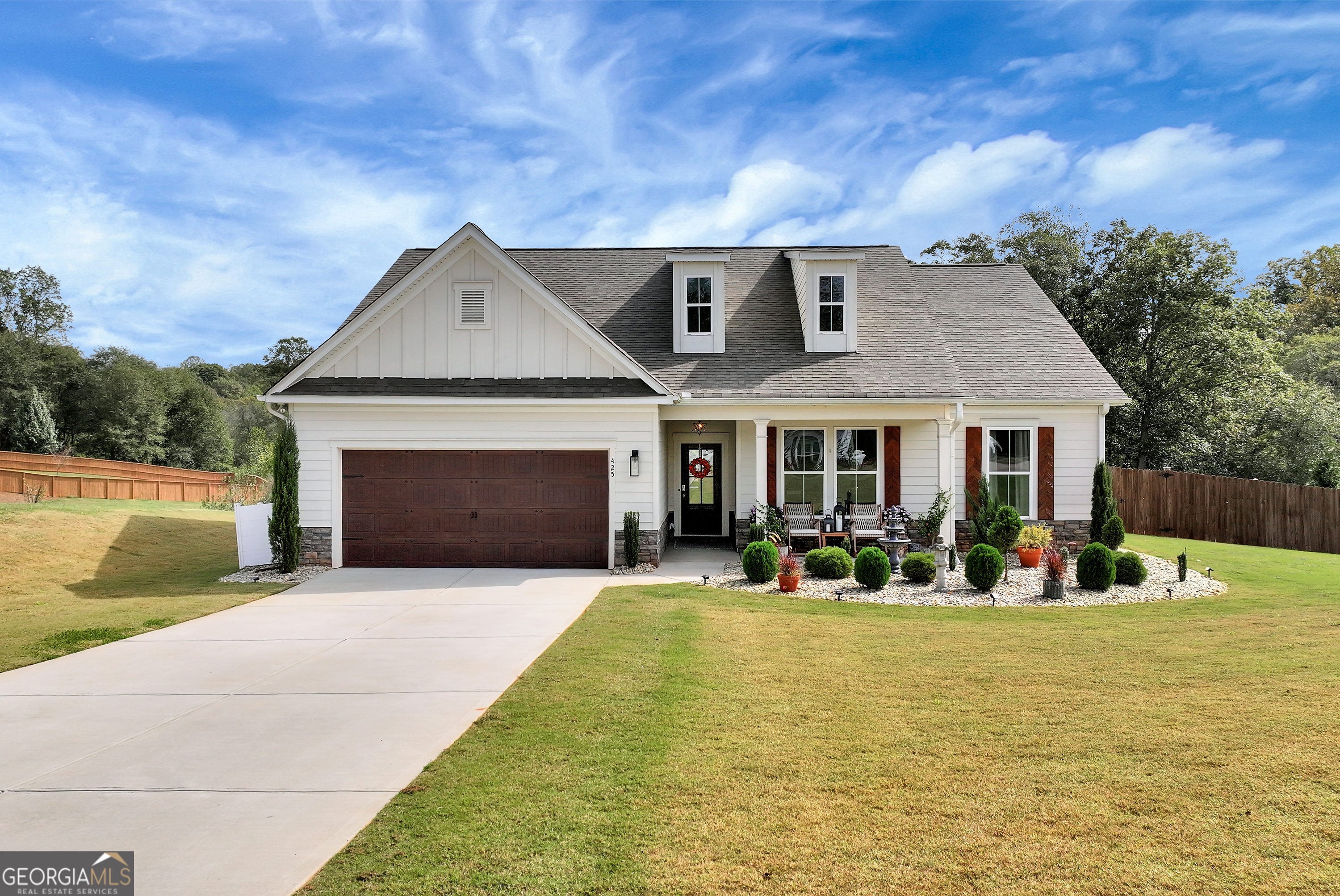 425 Crystal Way Cornelia, GA 30531 - Photo 27 of 46 a front view of house with yard and trees in the background