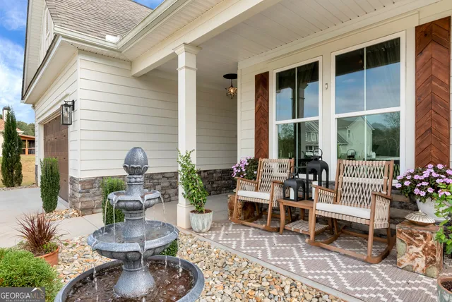 a building outdoor space with patio furniture and potted plants