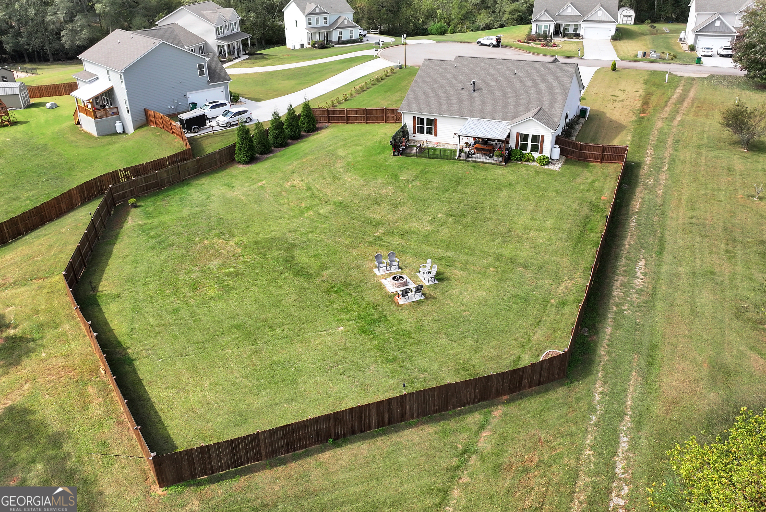 425 Crystal Way Cornelia, GA 30531 - Photo 4 of 46 a view of a swimming pool with a yard