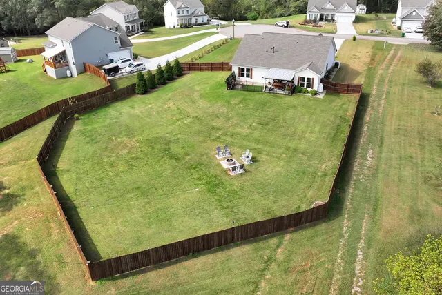 a view of a swimming pool with a yard