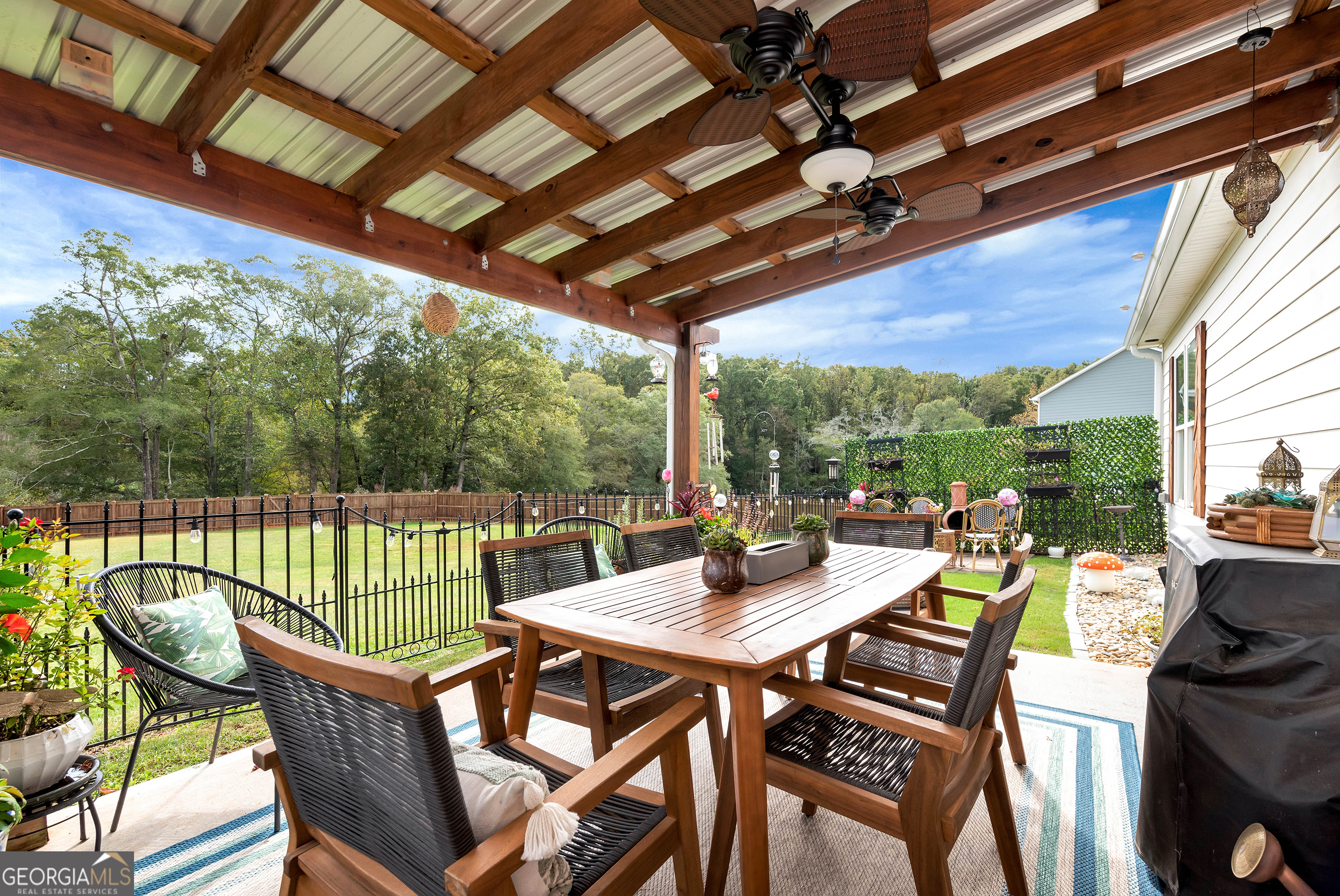 425 Crystal Way Cornelia, GA 30531 - Photo 6 of 46 a view of an outdoor dining space with furniture and wooden floor