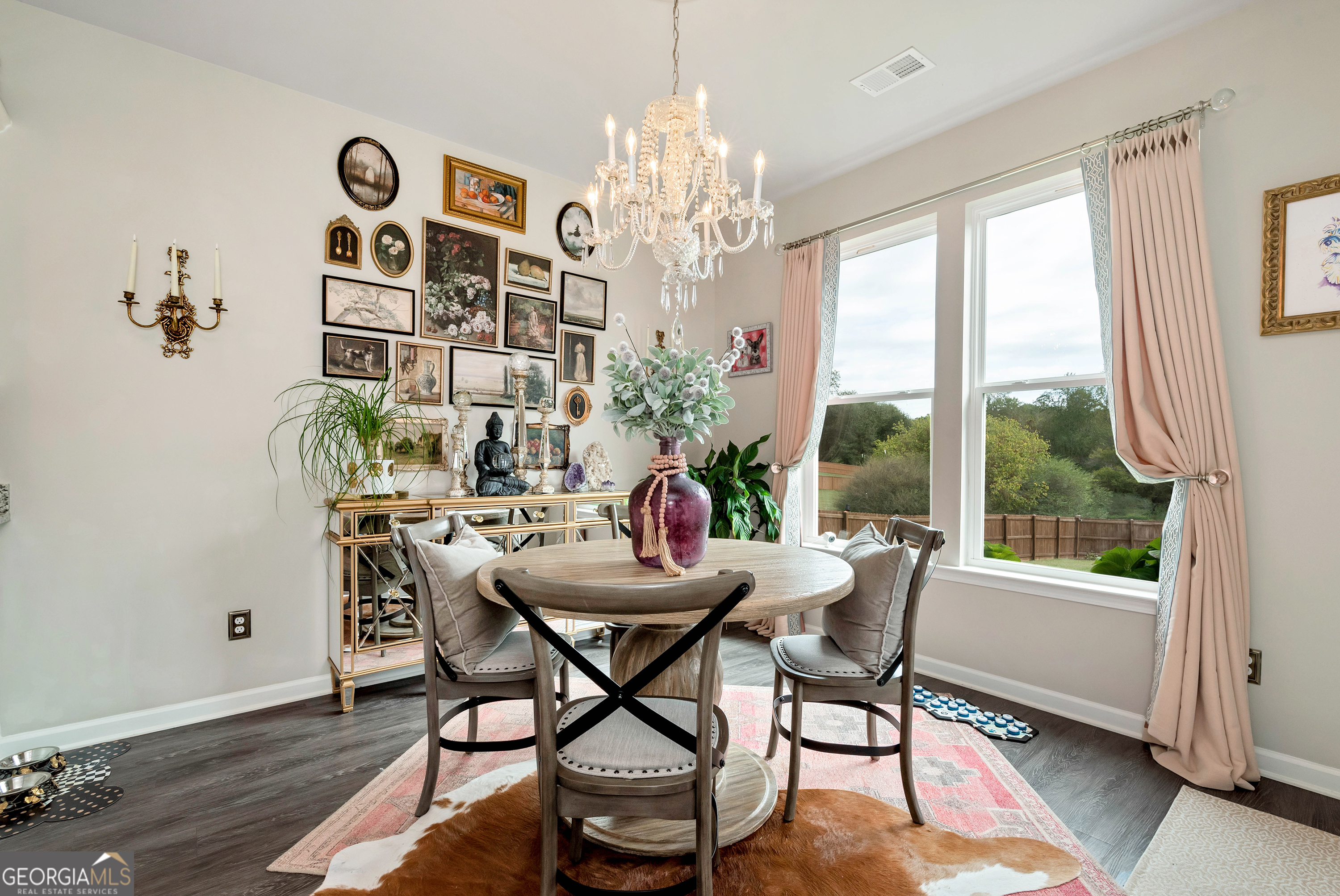 425 Crystal Way Cornelia, GA 30531 - Photo 10 of 46 a dining room with furniture a chandelier and wooden floor