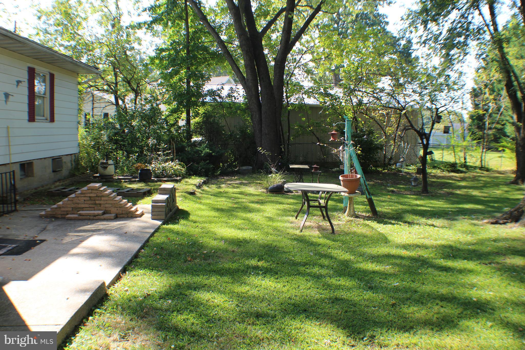 332 Worton Road Baltimore, MD 21221 - Photo 12 of 18 a garden with trees in the background