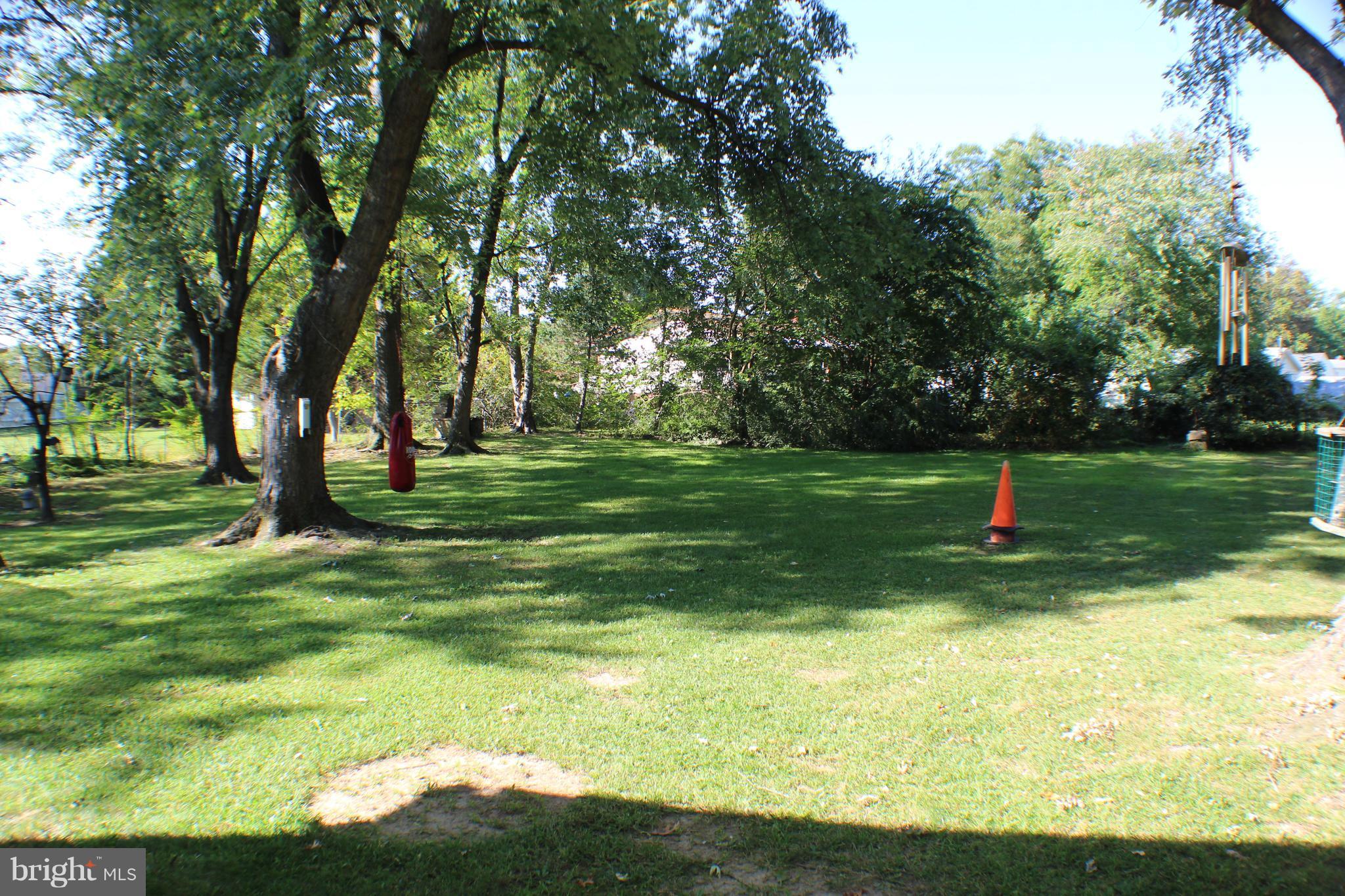 332 Worton Road Baltimore, MD 21221 - Photo 5 of 18 a backyard of a house with lots of green space and lake view