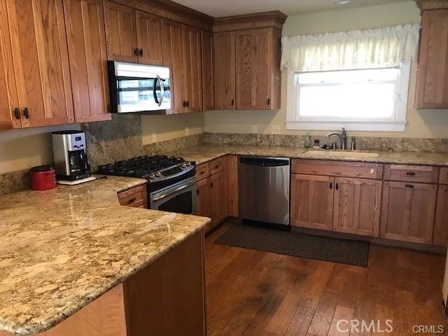 a kitchen with sink cabinets and window