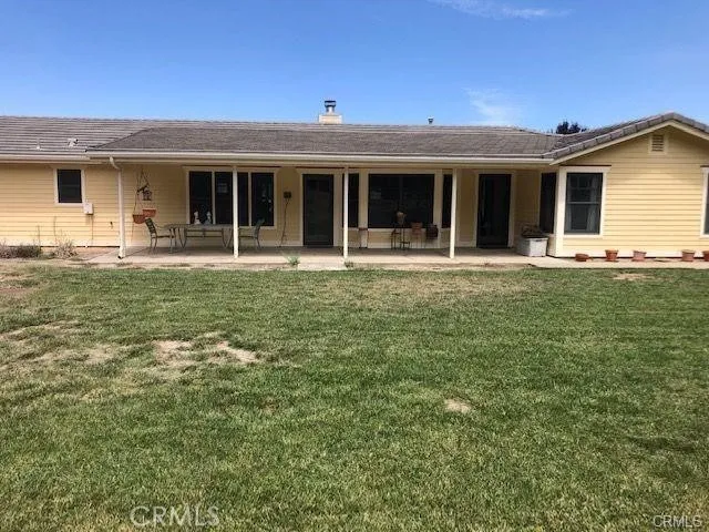 front view of a house with a garden