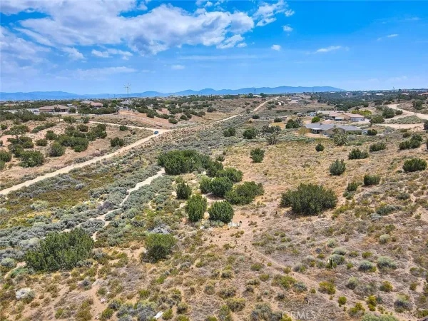 an aerial view of beach and residential space