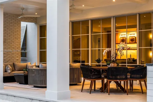 an aerial view of a house with yard and outdoor seating