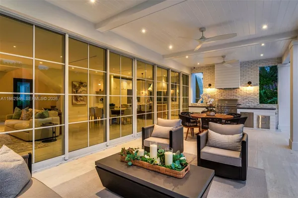 a living room with furniture and a dining table