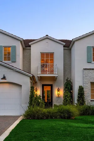 a kitchen with a stove a sink and a granite counter tops