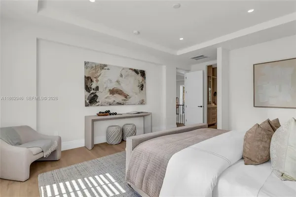 a bedroom with a bed and couch