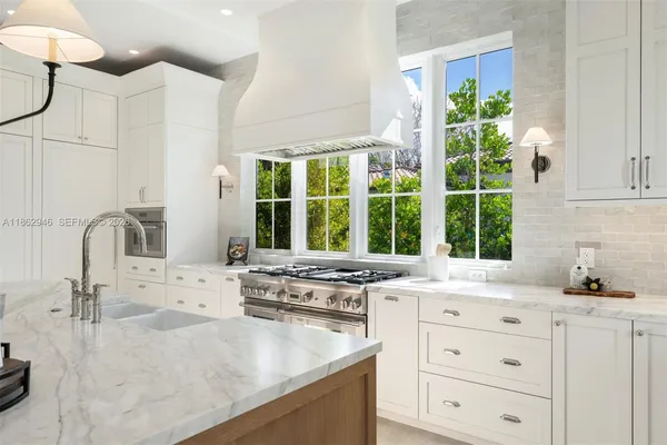 a bathroom with a double vanity sink mirror double and shower