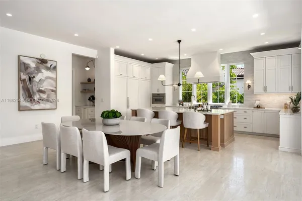 a kitchen with stainless steel appliances granite countertop a stove and a sink