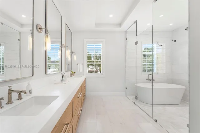 a bathroom with a double vanity sink mirror and double