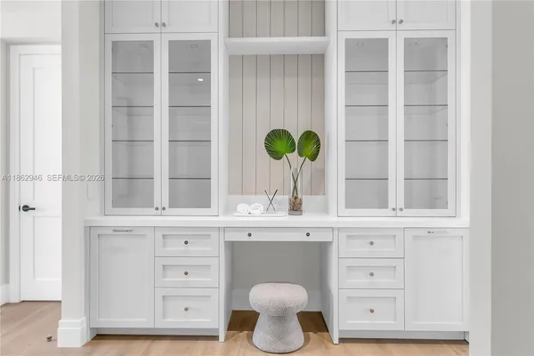 a view of cabinets with wooden floor