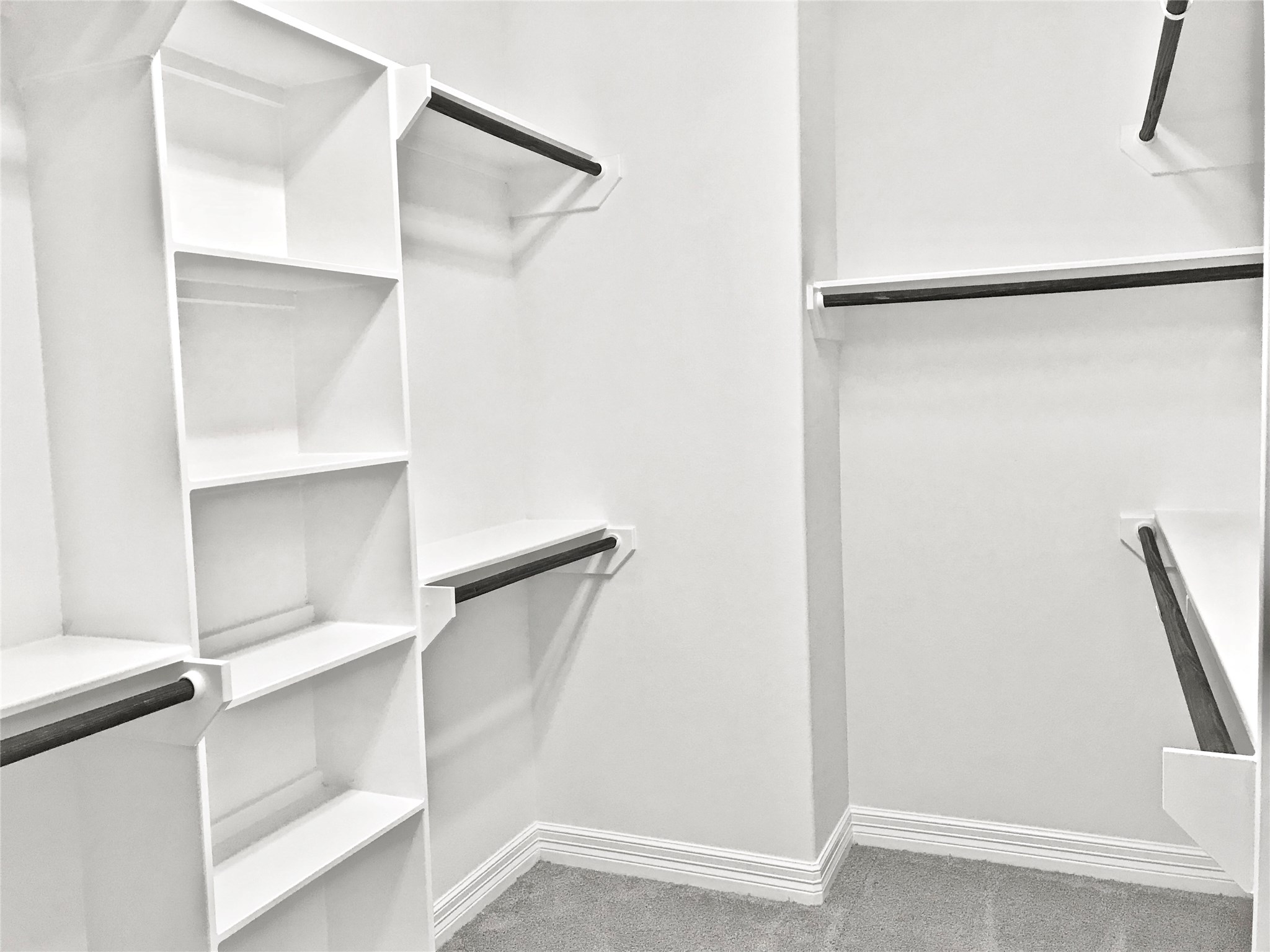 709 Link Road Houston, TX 77009 - Photo 27 of 46 a view of walk in closet with empty racks