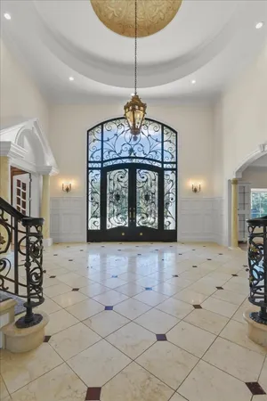 a spacious bathroom with a granite countertop sink a mirror and a