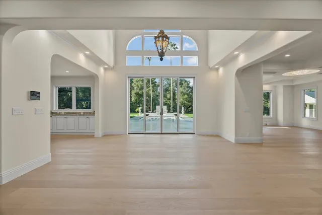a bathroom with a granite countertop sink toilet a mirror and shower