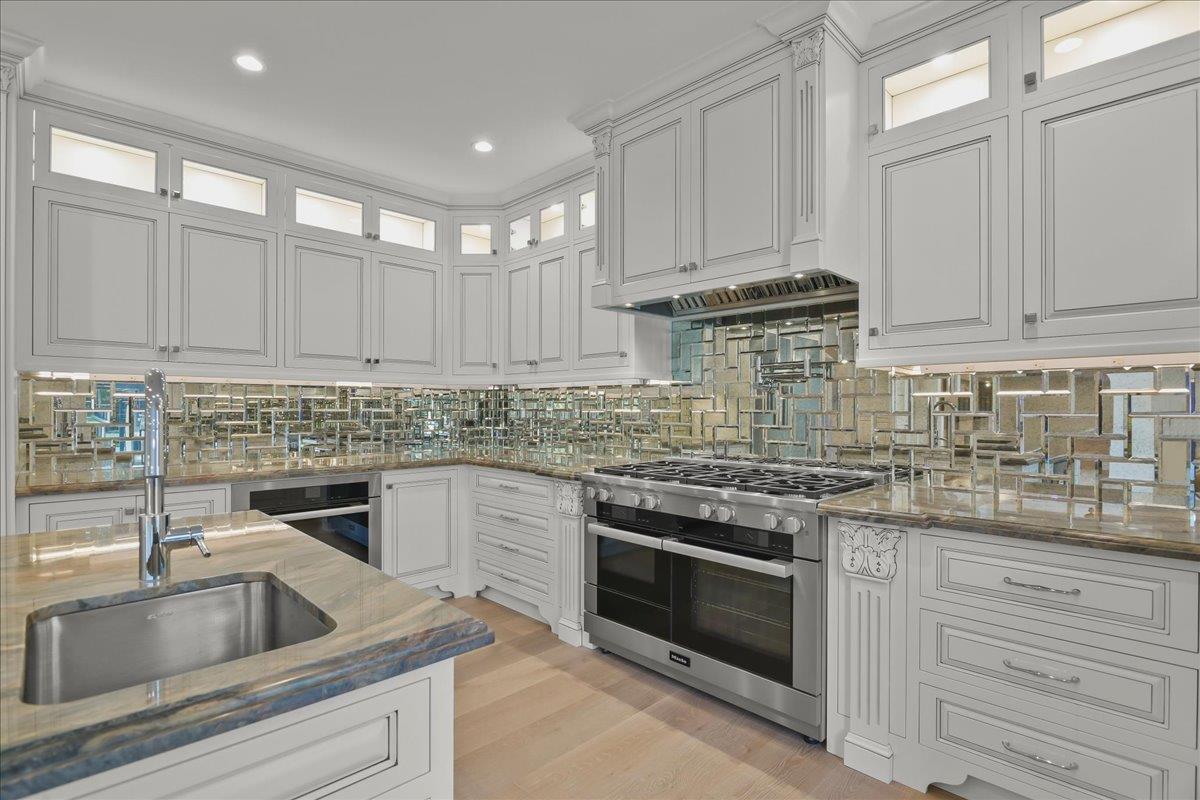 18911 Decatur Road Los Gatos, CA 95030 - Photo 44 of 143 a kitchen with granite countertop white cabinets and stainless steel appliances