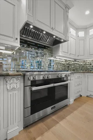 an aerial view of a house with garden space and street view