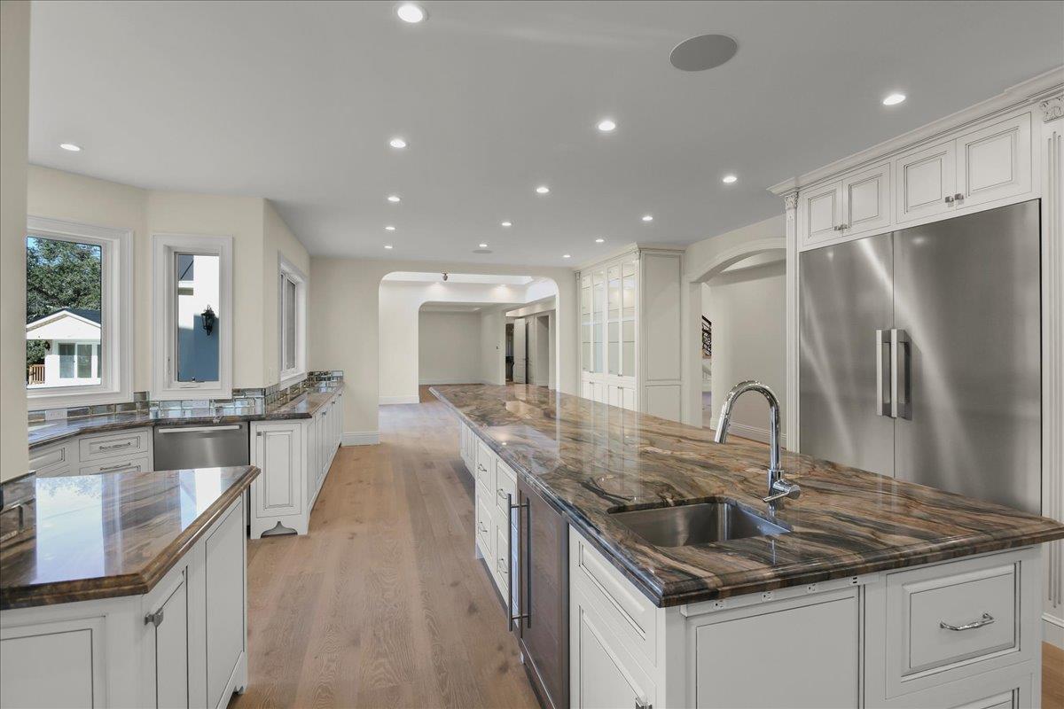 18911 Decatur Road Los Gatos, CA 95030 - Photo 46 of 143 a kitchen with stainless steel appliances granite countertop a sink a stove and a refrigerator