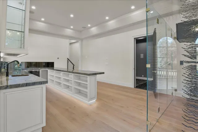a view of a house with swimming pool and sitting area