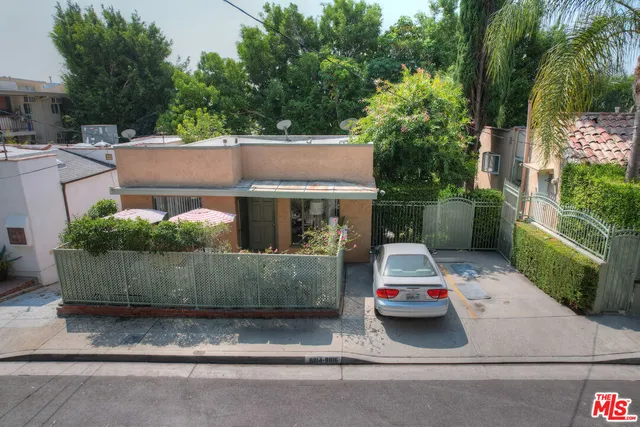 a view of house with a yard and tree s