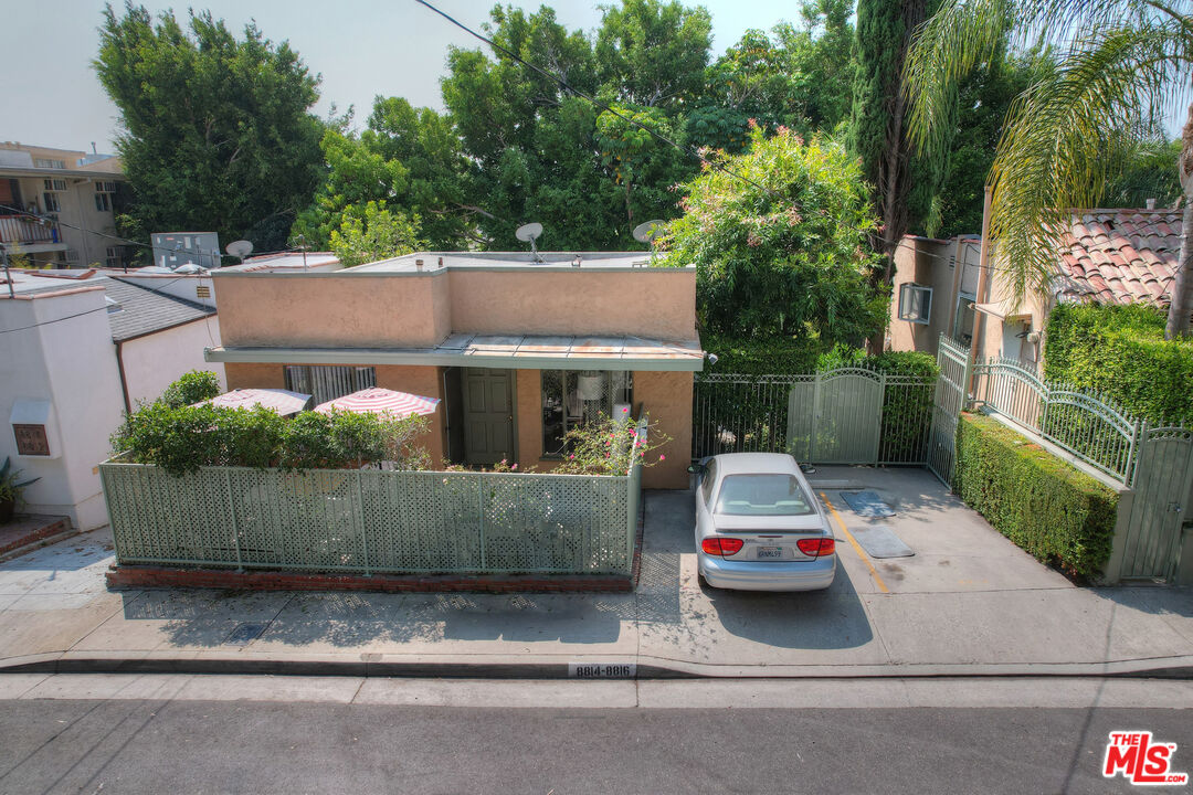 a view of house with a yard and tree s