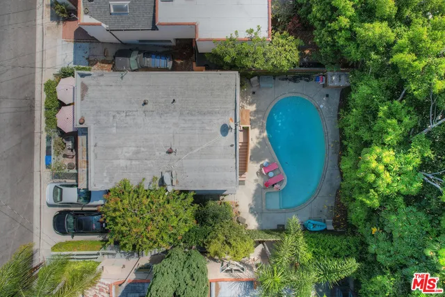 an aerial view of a house with a swimming pool