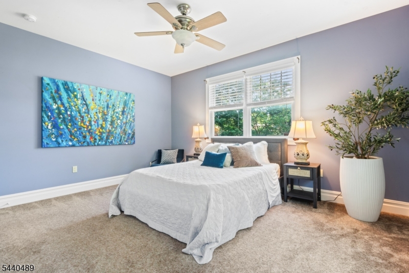 99 East Lindsley Road Cedar Grove, NJ 07009 - Photo 18 of 41 a bedroom with a large bed and a window