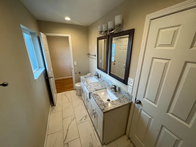 a bathroom with sink and mirror