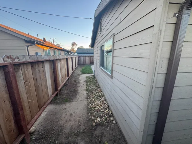 a view of a house with a yard and garage