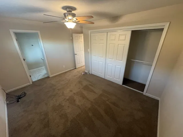 a view of an empty room with a fireplace