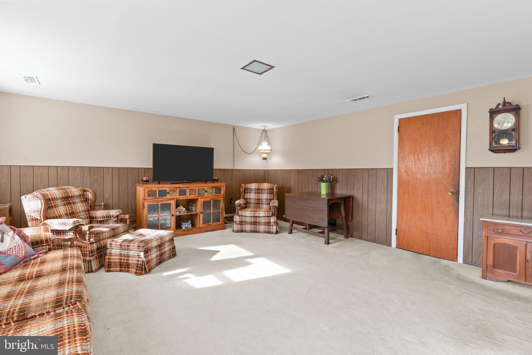 1001 Birch Road Warminster, PA 18974 - Photo 14 of 29 a view of a livingroom with furniture and a flat screen tv