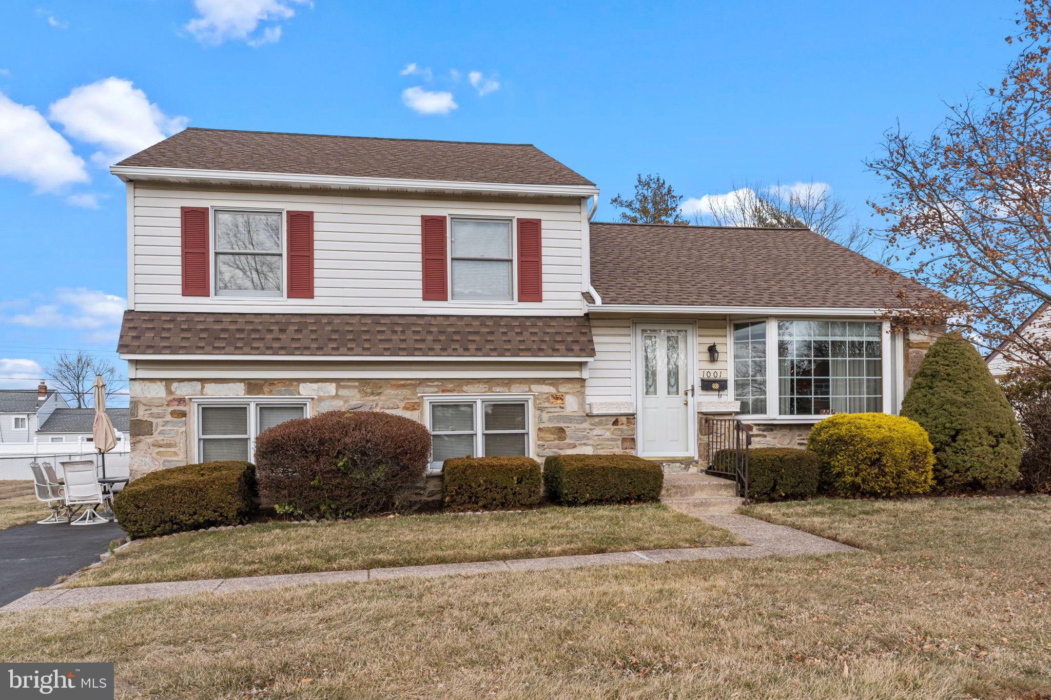 1001 Birch Road Warminster, PA 18974 - Photo 2 of 29 a front view of a house with a yard and potted plants