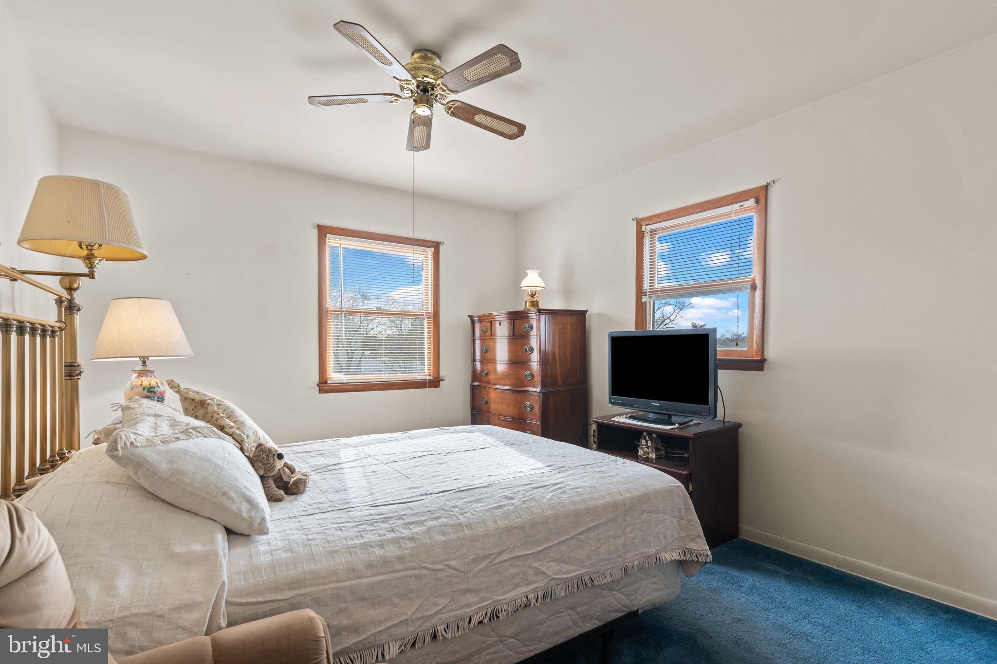 1001 Birch Road Warminster, PA 18974 - Photo 22 of 29 a bedroom with a bed a dresser and a flat screen tv