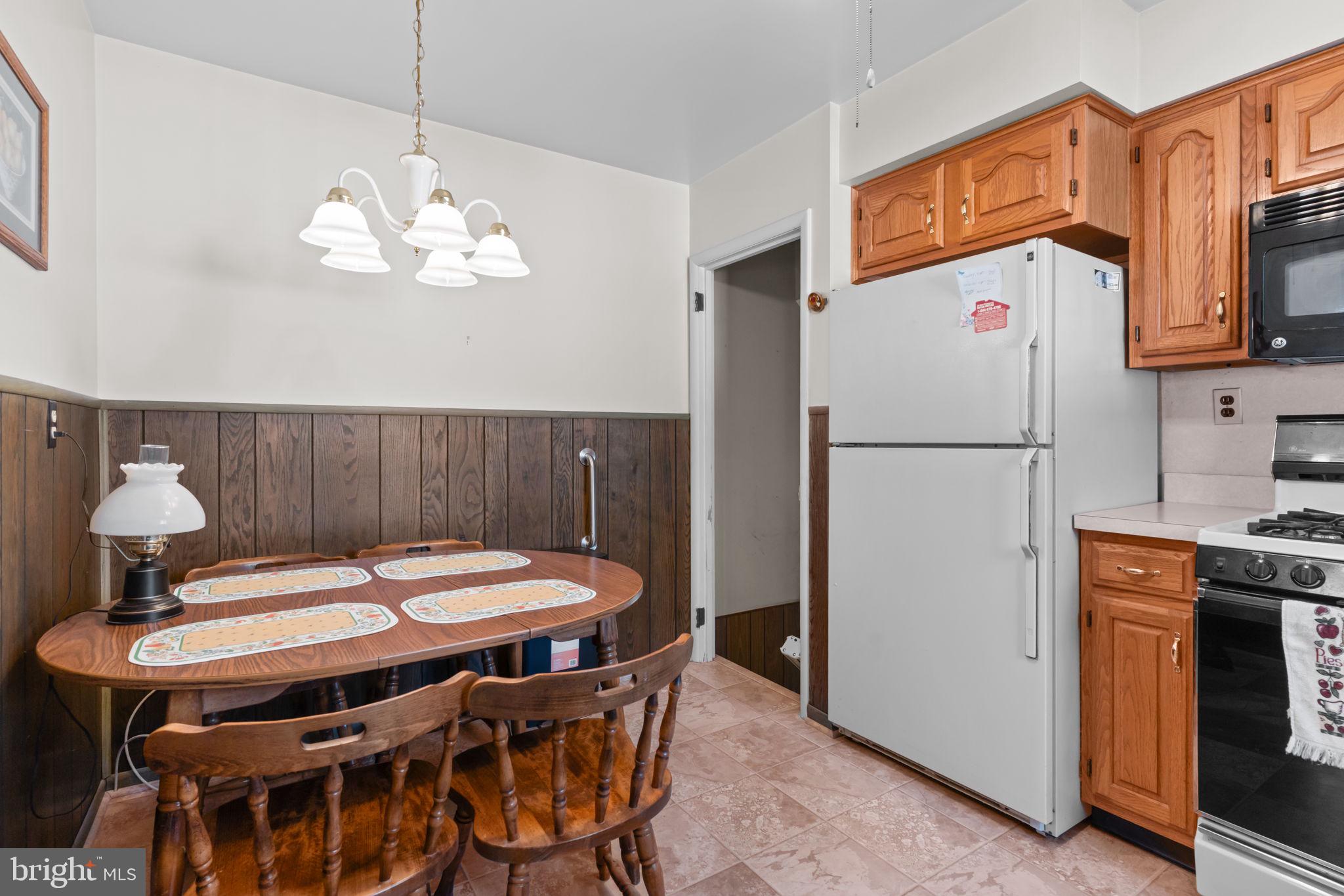 1001 Birch Road Warminster, PA 18974 - Photo 10 of 29 a table and chairs in a open kitchen