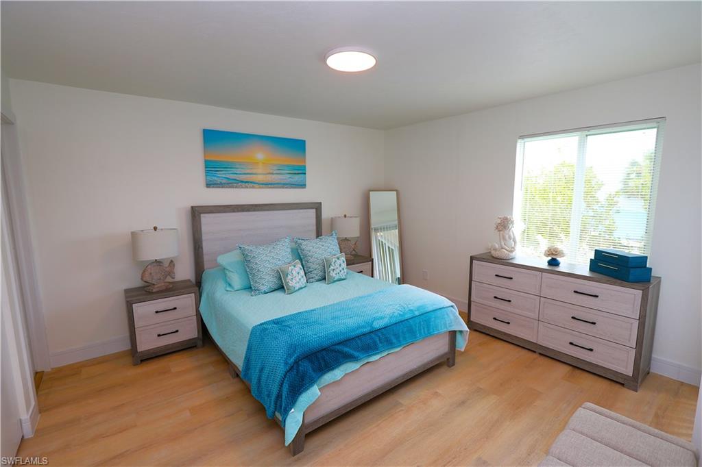 2235 San Marco Road, Unit 5204 Marco Island, FL 34145 - Photo 18 of 42 Bedroom featuring light wood-style floors