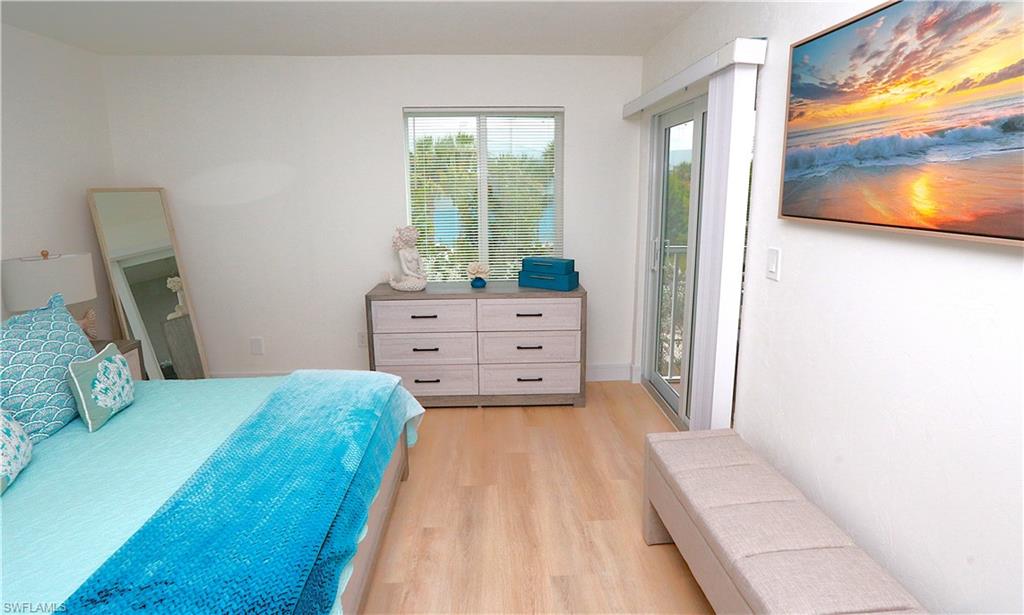 2235 San Marco Road, Unit 5204 Marco Island, FL 34145 - Photo 20 of 42 Bedroom with access to outside and light wood-style floors