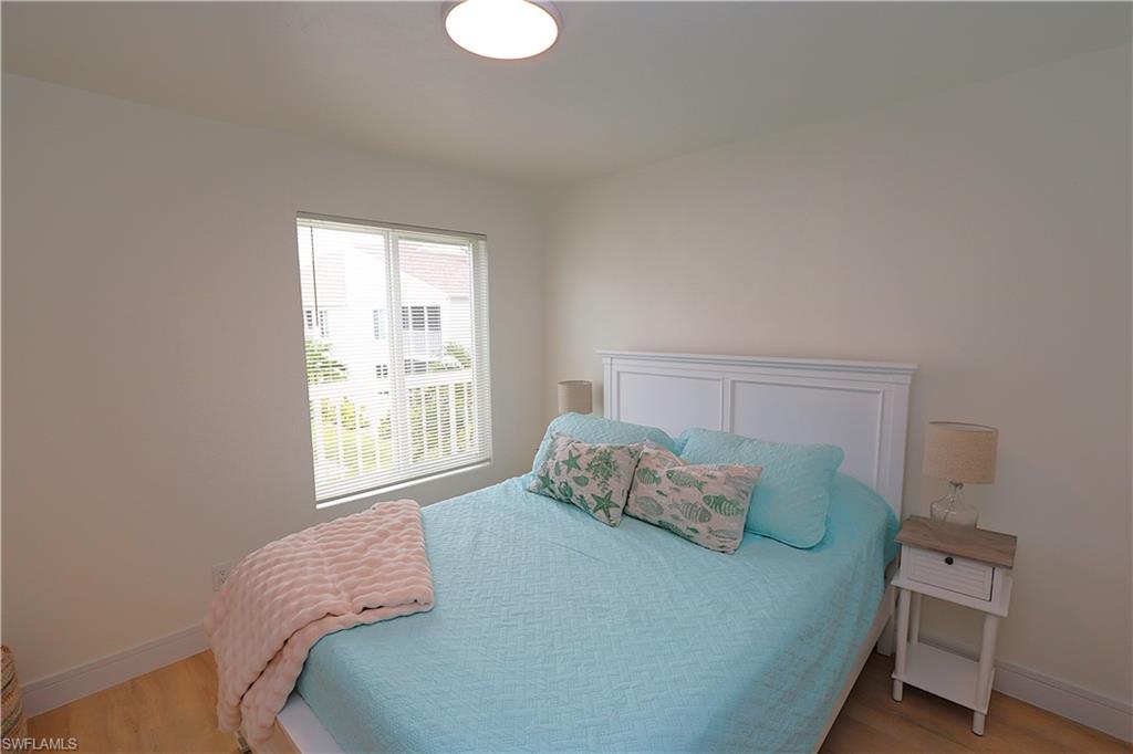 2235 San Marco Road, Unit 5204 Marco Island, FL 34145 - Photo 25 of 42 Bedroom featuring light wood-style flooring