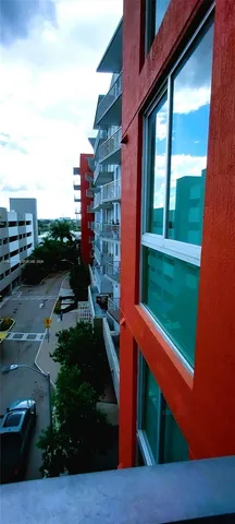 a view of a chairs and table in the balcony
