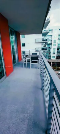 a view of a hallway with furniture and entryway
