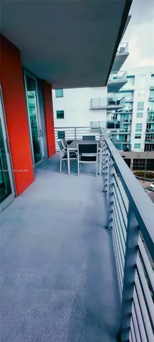 a view of a hallway with furniture and entryway