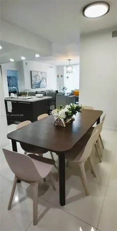 a kitchen with a sink and stainless steel appliances