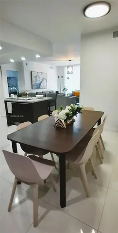 a kitchen with a sink and stainless steel appliances